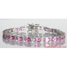 Tennis bracelet pink sapphire. Sterling silver tennis bracelet with lab created pink sapphire.